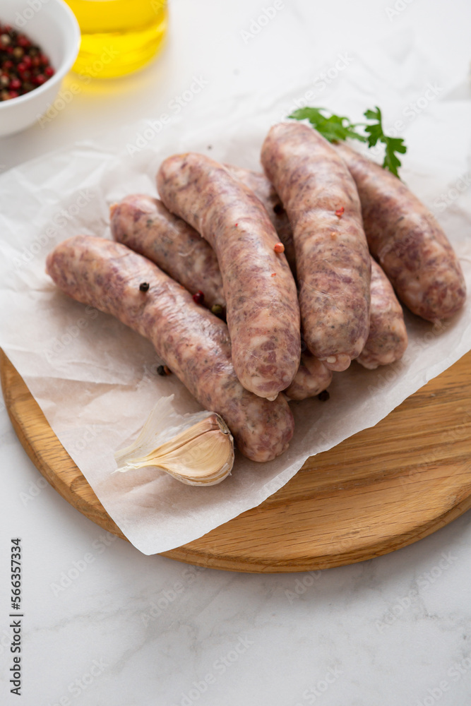 Close up of barbecue sausage on packing paper and spice cooking food Close up of barbecue sausage on packing paper and spice cooking food