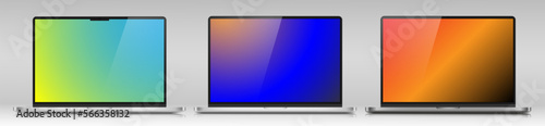 A set of realistic laptops with color screens on a gray gradient background. Layouts of three laptops in a metal case. Vector EPS 10.