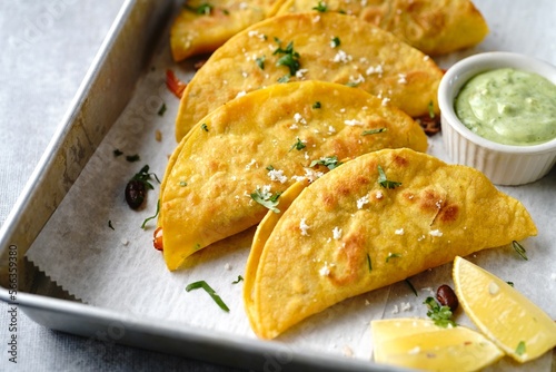 Crispy fried rice and beans tacos | Game day appetizer served with avacado cream sauce