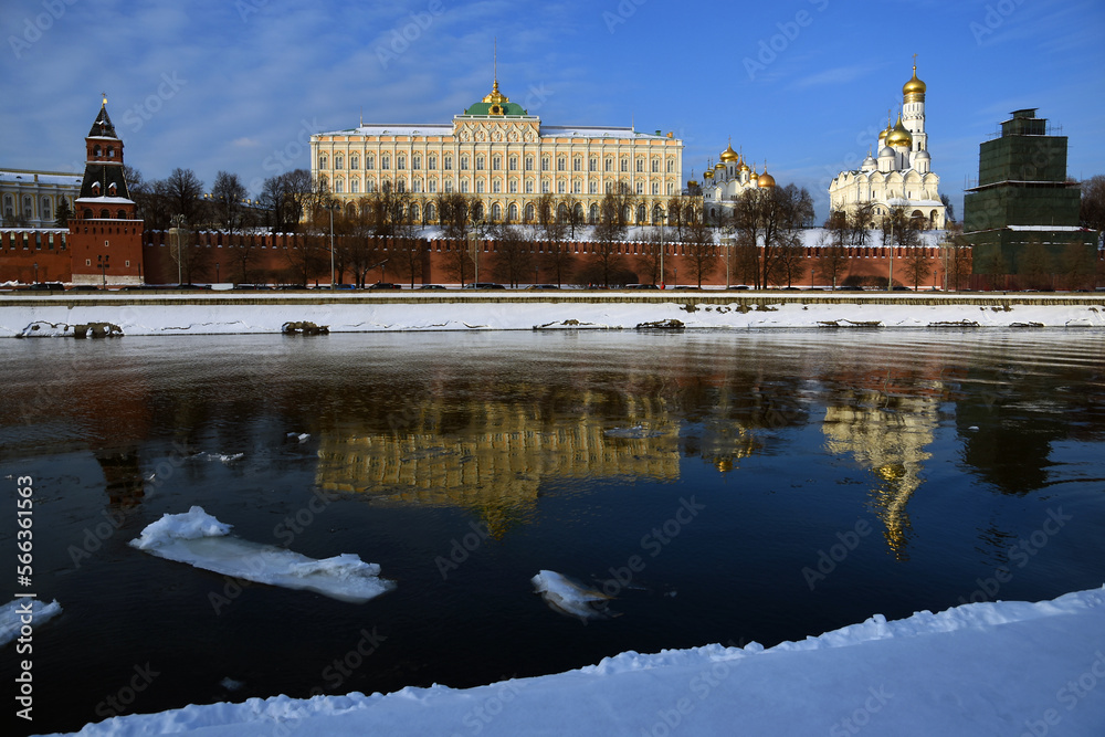 The Grand Palace and ancient churches of Moscow Kremlin in winter. Blue sky background.
