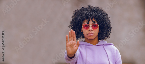 feminist woman with hand in front in stop sign photo