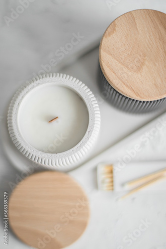 Top view set of Candles, concrete with black and white color, in a unique candle holder and oval coaster made from concrete in white colors.
