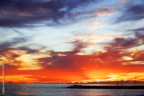 Sunset sky clouds over the sea in Apulia, Italy. Beautiful sunlight in the sea. Amazing nature landscape seascape Colorful sky clouds background.	