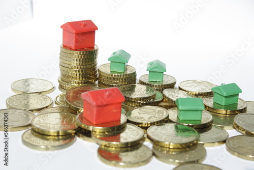 money, coins and red and green houses