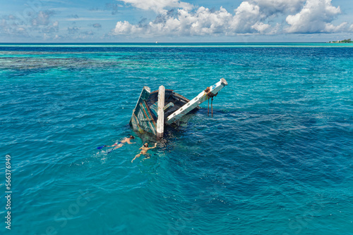 Aerial view of a sunken ship near Keyodhoo, Vaavu Atoll, Maldives, Indian Ocean. A place for tourists engaged in diving and snorkeling photo