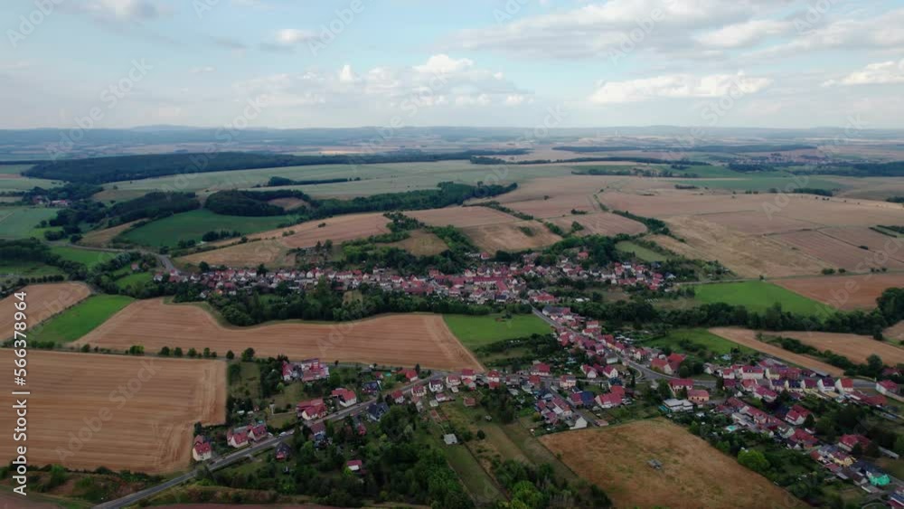 Aer ial view of a German village surrounded by meadows, farmland and forest in Germany. Aer ial view of a German village surrounded by meadows, farmland and forest in Germany.