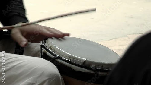 Man Playing Latin Drum. Close Up.   photo