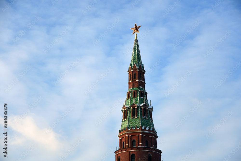 Moscow Kremlin tower decorated by the ruby star at blue sky background