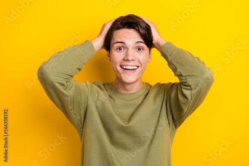 Portrait of astonished satisfied person toothy smile cant believe isolated on yellow color background © deagreez