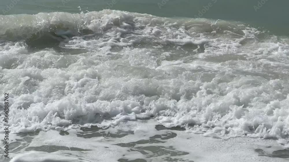 Tight shot with sound of moderate surf breaking on beach Tight shot with sound of moderate surf breaking on beach