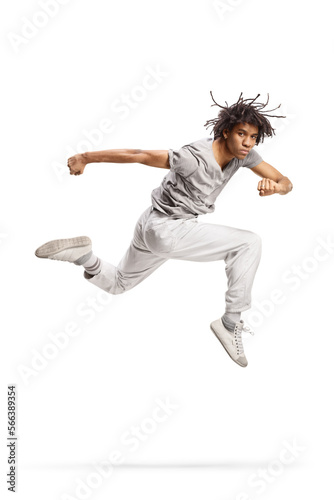 African american young male performing a jump