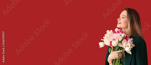 Happy young woman with bouq...