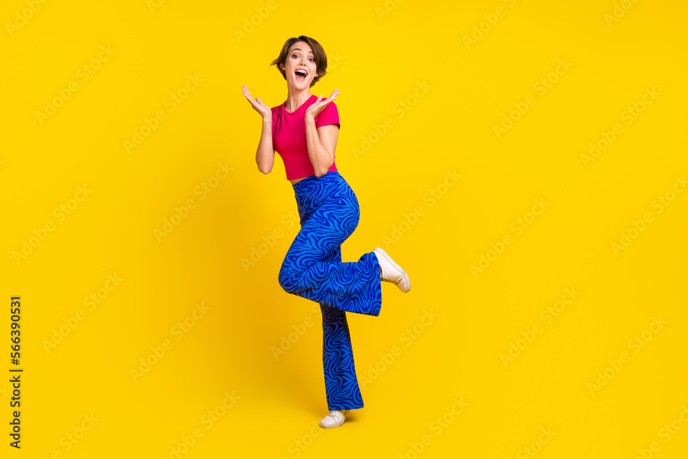 Photo of pretty cute cheerful lovely lady wear bright pink clothes rejoice special offer empty space isolated on yellow color background
