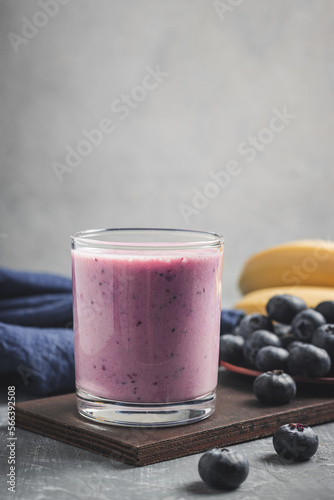 Blueberry and banana smoothie drink in a glass, healthy eating concept