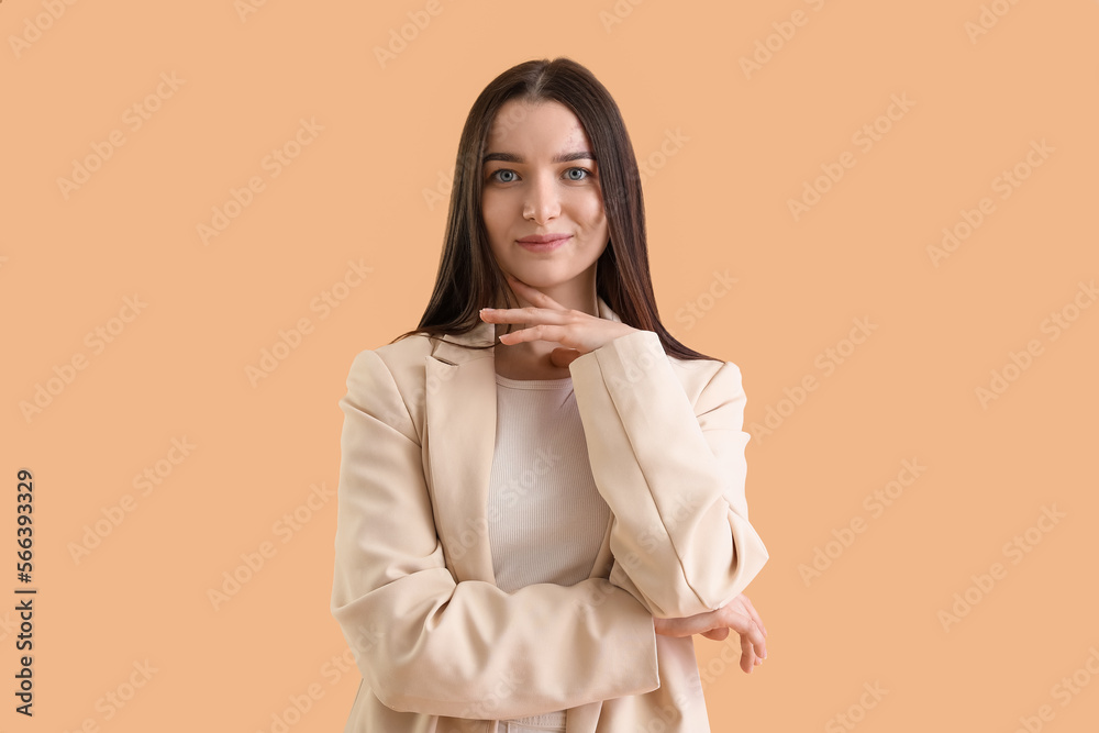 Young woman in stylish jacket on beige background Young woman in stylish jacket on beige background