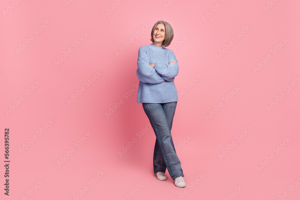 Photo of adorable stunning lady arms crossed interested look empty space special offer novelty big sale isolated on pink color background Photo of adorable stunning lady arms crossed interested look empty space special offer novelty big sale isolated on pink color background