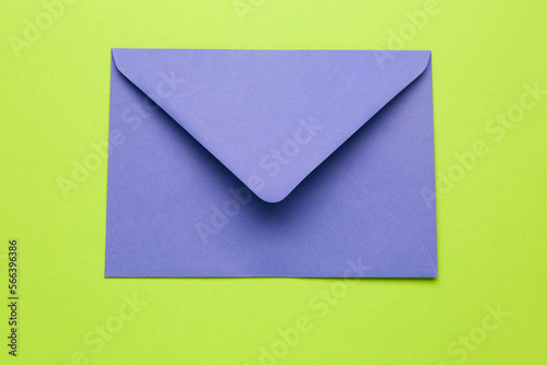 Blue paper envelope on green background