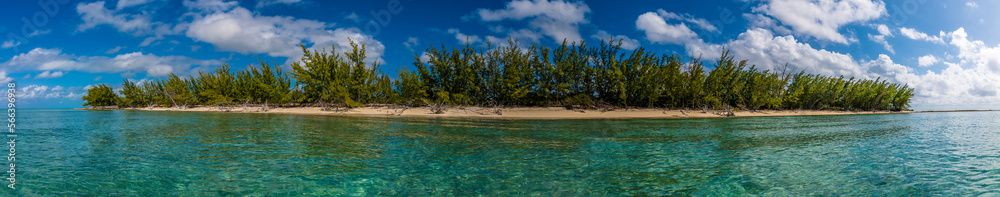 A panorama view from the sea of the Carribean island of Eleuthera, Bahamas on a bright sunny day