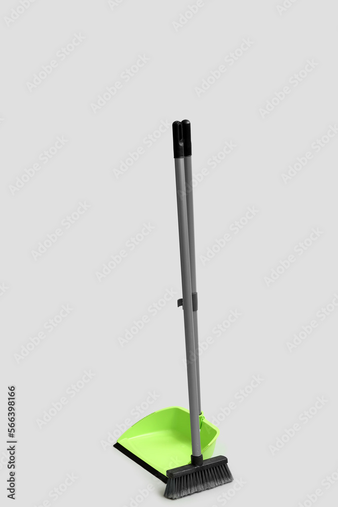 Dustpan with cleaning broom on white background Dustpan with cleaning broom on white background