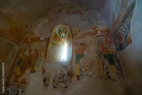 Loophole window and frescoes around it in Hermitage of San Baudelio de Berlanga, Caltojar, province of Soria, Spain. photo