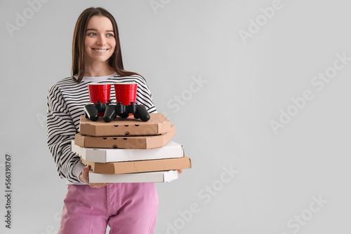 Young woman with boxes of t...