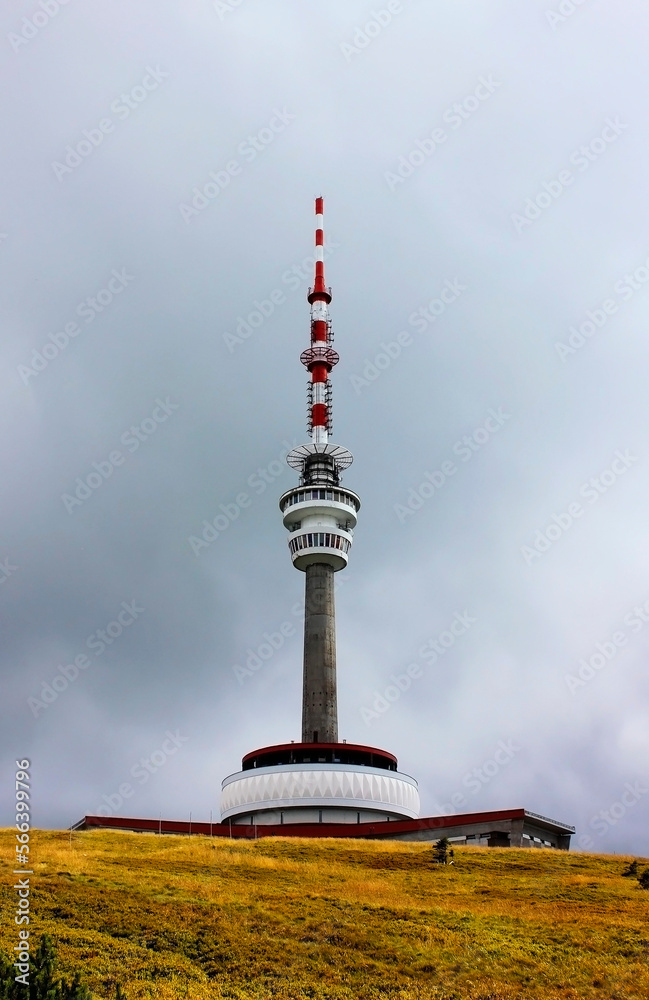 Obraz premium A TV transmitter on the top of the Praded mountain, the highest peak of the Jeseni­ky mountains, Czech Republic, Europe. Cloudy day in the mountains.