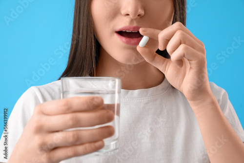 Young woman with glass of w...