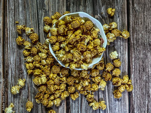 Popcorn is a variety of corn kernel which expands and puffs up when heated.