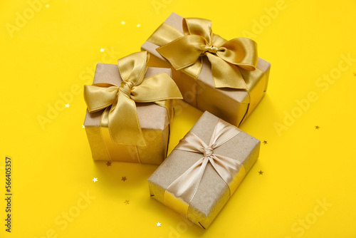 Beautiful gifts for Women's Day celebration on yellow background