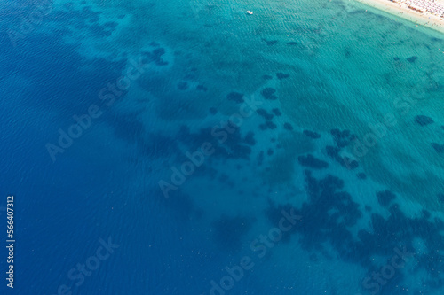 Shallow water and reef by 7 km long beach in village Borsh, Albania in Summer 2022