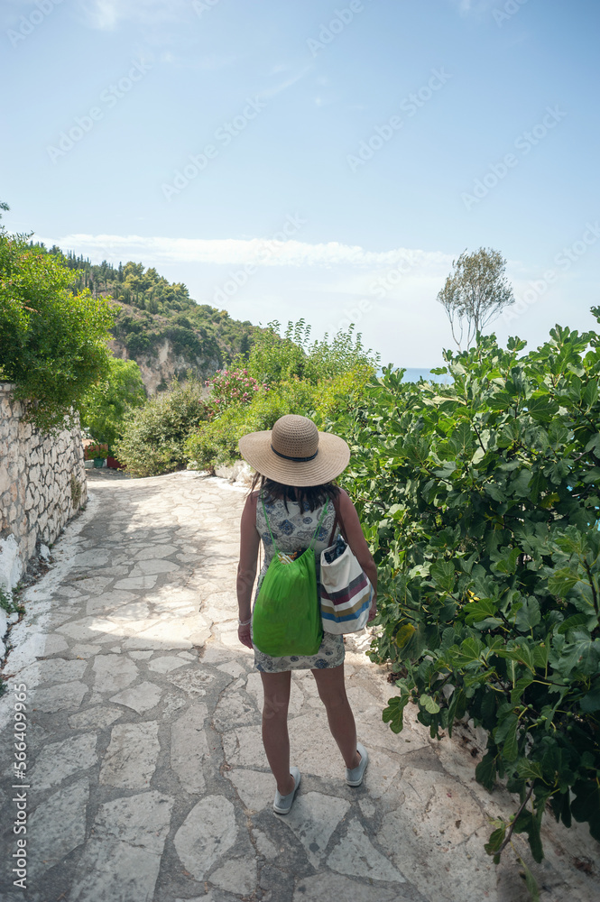 A young woman is walking and exploring the Greek island of Lefkada