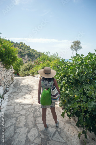 A young woman is walking and exploring the Greek island of Lefkada © Milos