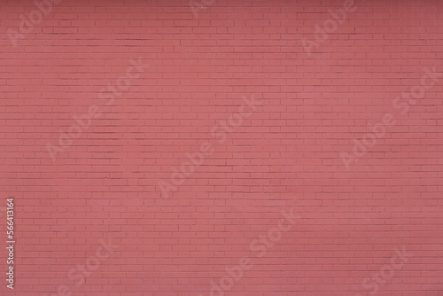 Red brick wall texture. Decorative plaster imitating brickwork. Background with plastered and painted wall.