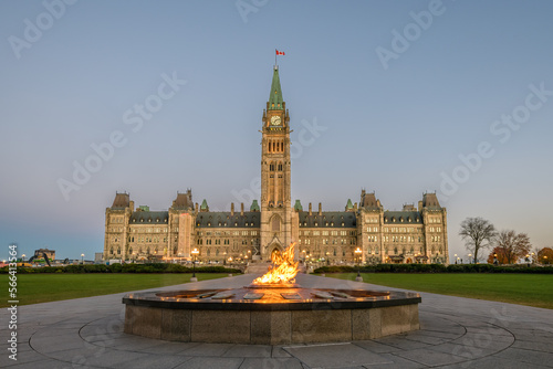 Photos Parliament of Canada Peace Tower with Centennial Flame in foreground in early mo