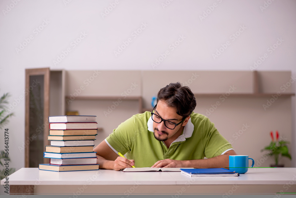 Young male student studying at home Young male student studying at home