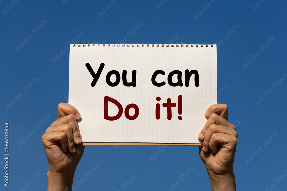 You can do it message on a notebook paper which is held by 2 hands with blue sky background. This is business concept to encourage and motivate people to do some thing. You can do it message on a notebook paper which is held by 2 hands with blue sky background. This is business concept to encourage and motivate people to do some thing.