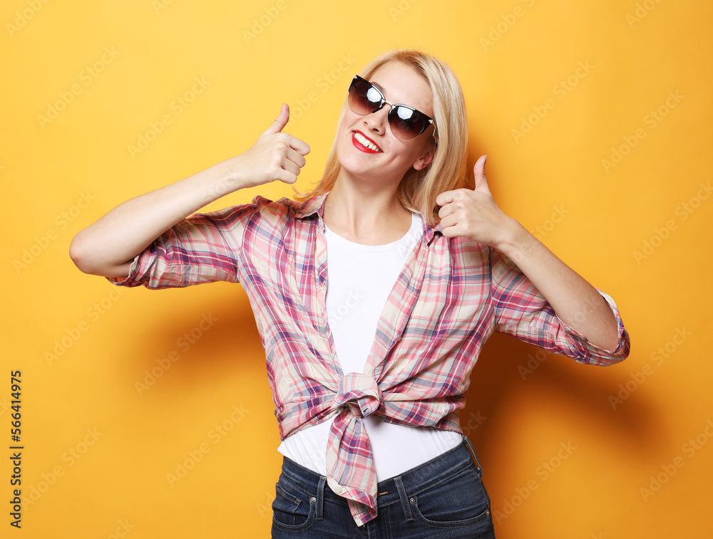 Lifestyle, emotion and people concept: happy woman giving a thumb up