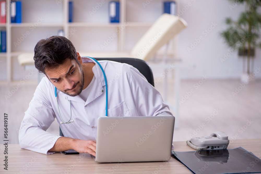 Young male doctor working in the clinic