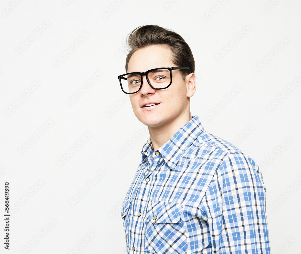 Portrait of a young man wearing casual standing against white background Portrait of a young man wearing casual standing against white background