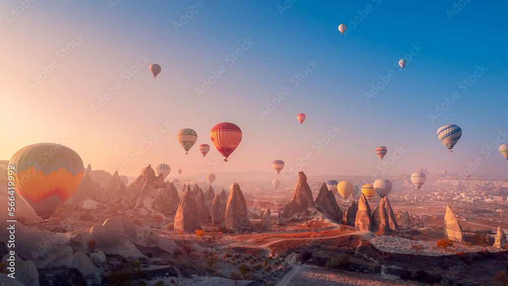 Landscape sunrise in Cappadocia with set colorful hot air balloon fly in sky with sunlight. Concept tourist travel Goreme Turkey - obrazy, fototapety, plakaty 