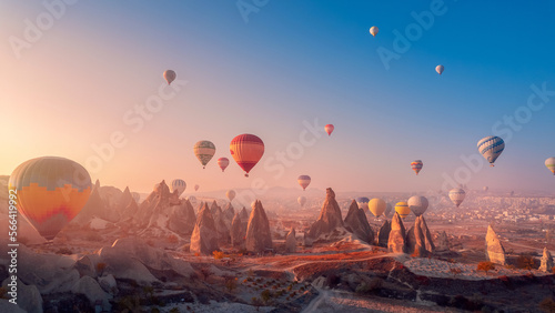 Landscape sunrise in Cappadocia with set colorful hot air balloon fly in sky with sunlight. Concept tourist travel Goreme Turkey