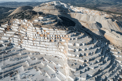 Obraz na plátně Top view Industry marble quarry and cut white blocks, working yellow tractor, dr