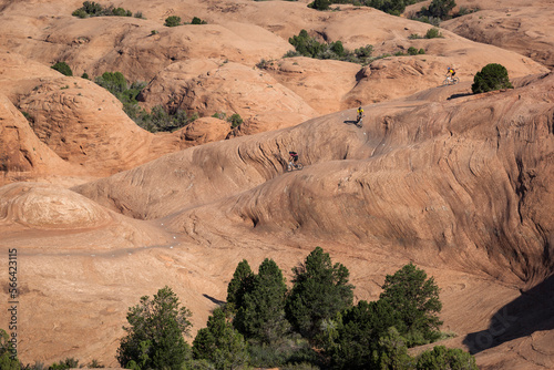 Mountain bikers riding on the slickrock trail in Moab, Utah. photo