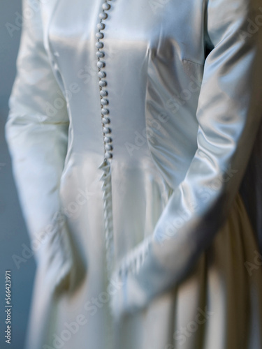 Details of 19th century wedding dress in a museum in a historic Jewish synagogue