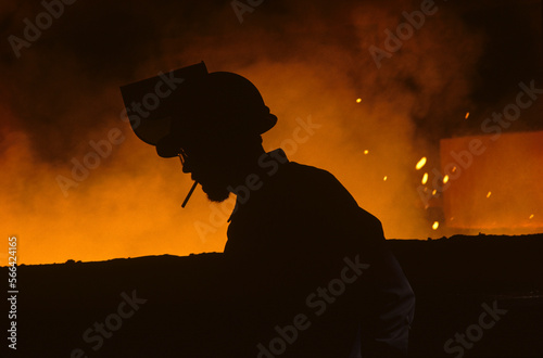 Silhouette of steel worker at steel plant in Midlothian, Texas. photo