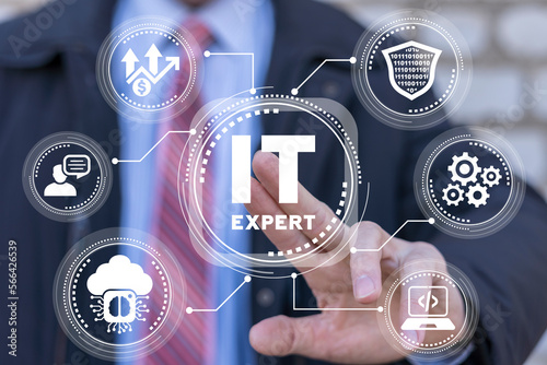Businessman using virtual touchscreen presses inscription: IT EXPERT. IT Information Technology expert concept. Big Data Technology for Business Finance Analytic, Advice or Services.