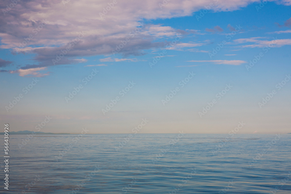 Seascape with horizon over water taken from Gaspésie showing the wide part of the Saint Lawrence River.