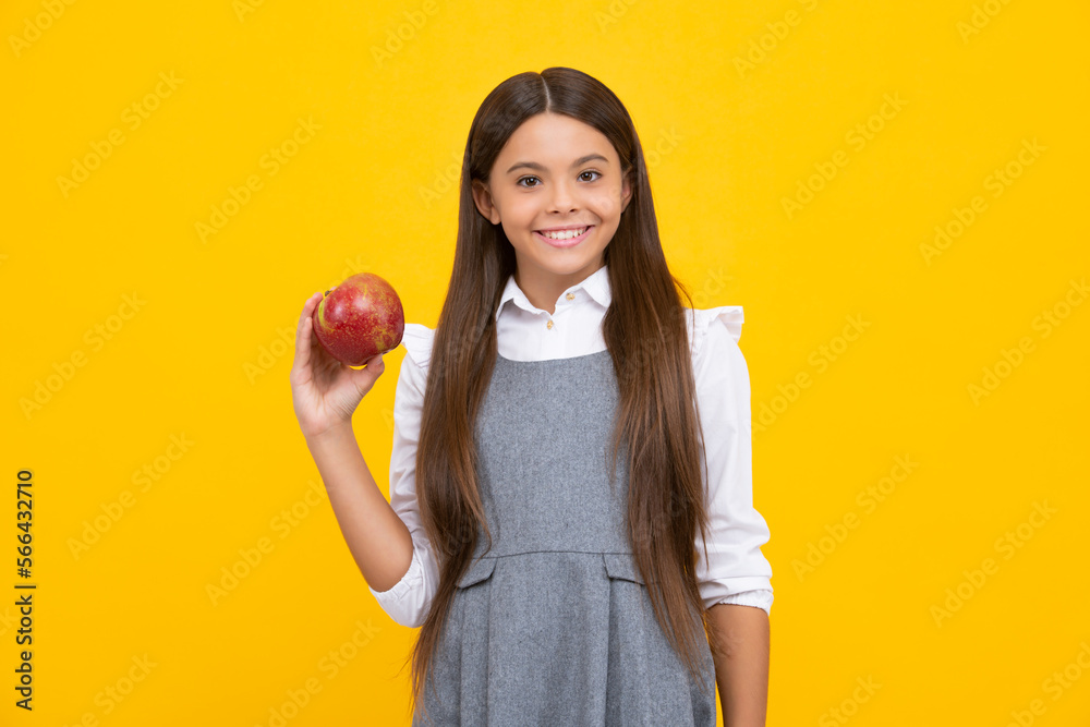 Teenager child with apple on yellow isolated background. apples are good for children. Happy girl face, positive and smiling emotions. Teenager child with apple on yellow isolated background. apples are good for children. Happy girl face, positive and smiling emotions.