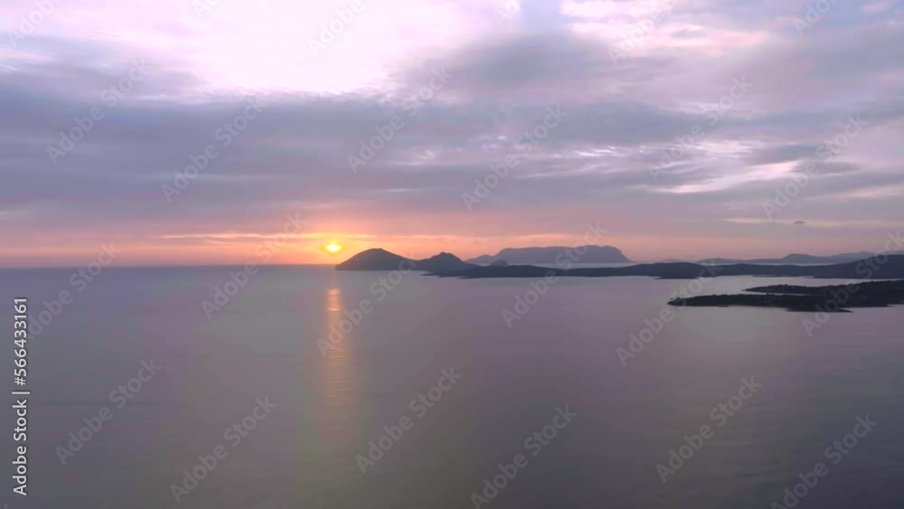 Stunning orange sunrise over calm sea with islands and beaches Stunning orange sunrise over calm sea with islands and beaches