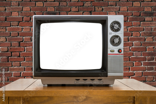 Old television on table wit...
